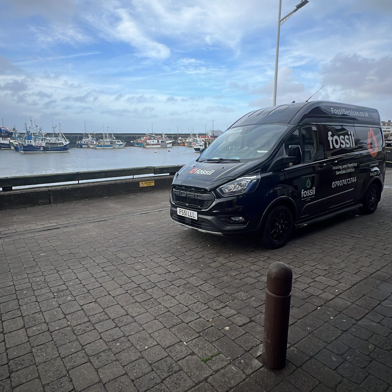 Fossil branded van at Scarborough harbour